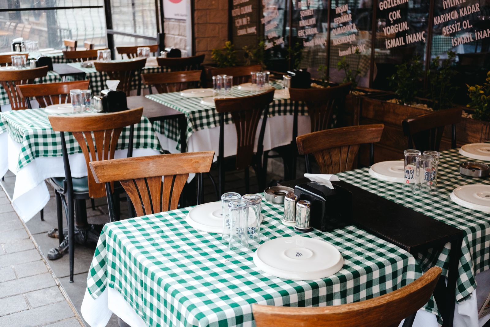 An empty pizzeria dining room mid-afternoon before the dinner rush